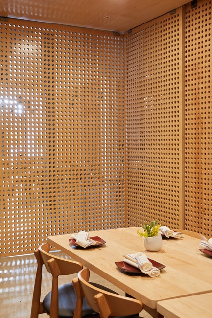 Press kit | 2757-07 - Press release | Ancient Art of Japanese Tattooing Inspires Latest Little Tokyo Restaurant in Los Angeles - Wick Architecture & Design + LAND Design Studio - Commercial Architecture -    The floor-to-ceiling perforated panels cleverly enclose the private dining room&nbsp; at Sake Dojo and provide dappled views from both inside and out.    - Photo credit: Nicole LaMotte Photography