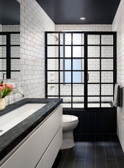 Press kit | 2875-06 - Press release | Park Slope Duplex Apartment - Barker Architecture Office - Residential Interior Design -  Children's bath with Custom blackened steel shower enclosure. Tile by Nemo and vanity by Furniture Guild. Countertio is Jet Mist.  - Photo credit: Amy Barkow
