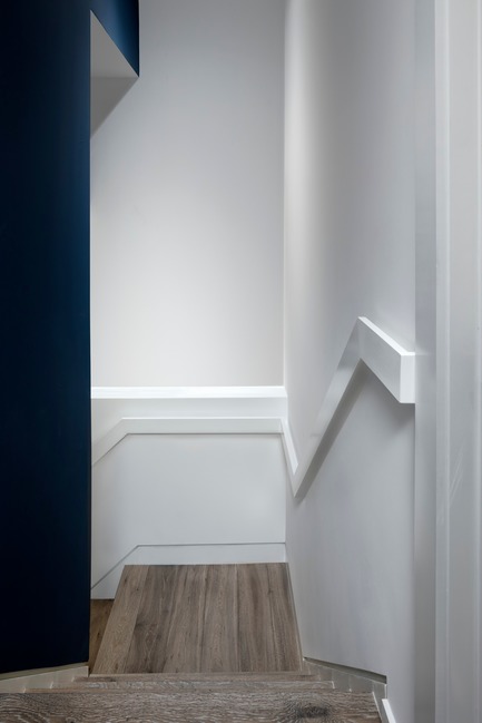 Press kit | 2875-06 - Press release | Park Slope Duplex Apartment - Barker Architecture Office - Residential Interior Design -  Stair to lower level family room. - Photo credit: Amy Barkow