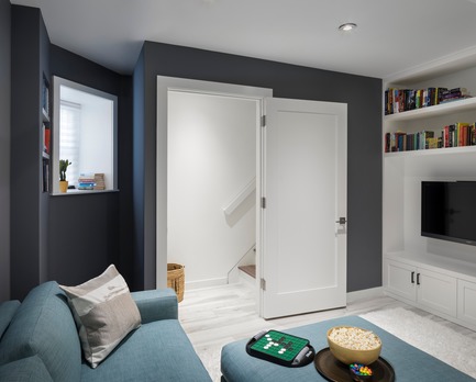 Press kit | 2875-06 - Press release | Park Slope Duplex Apartment - Barker Architecture Office - Residential Interior Design -  Lower level family room with custom millwork and porcelain floor from Artistic Tile. - Photo credit: Amy Barkow