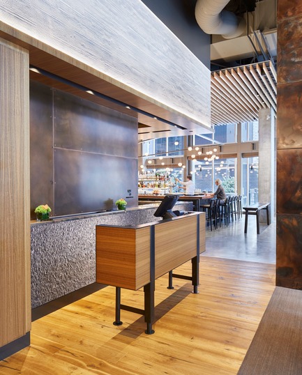 Press kit | 2886-02 - Press release | Wild Ginger Denny Triangle - SkB Architects - Commercial Interior Design - Reception with a view into bar area - Photo credit: Hannah Rankin