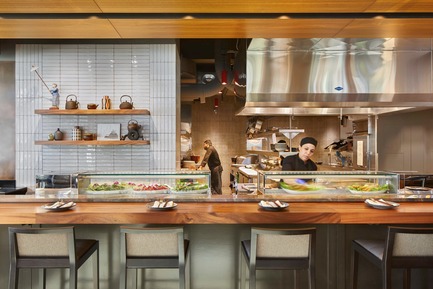 Press kit | 2886-02 - Press release | Wild Ginger Denny Triangle - SkB Architects - Commercial Interior Design - A view from the fresh bar into the open kitchen - Photo credit: Ben Benschneider