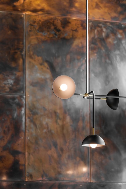 Press kit | 2886-02 - Press release | Wild Ginger Denny Triangle - SkB Architects - Commercial Interior Design - Beaubien Double Shade light by Lambert &amp; Fils Studio with patinated copper paneling in the backdrop - Photo credit: Hannah Rankin