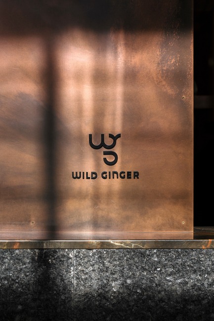 Press kit | 2886-02 - Press release | Wild Ginger Denny Triangle - SkB Architects - Commercial Interior Design - Patinated copper panels provide a strong visual feature for guests upon entry - Photo credit: Hannah Rankin