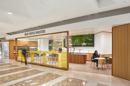 Press kit | 2682-01 - Press release | Innovation Through Design - The Symbiotic Link Between Branding and Architecture - Williamson Williamson Inc. - Commercial Interior Design -   Pilot First Canadian Place Cafe: The picture window opens to entrances on either side, allowing for unencumbered movement through the retail space. <br>[Completion Date: September 2017]    - Photo credit: Scott Norsworthy