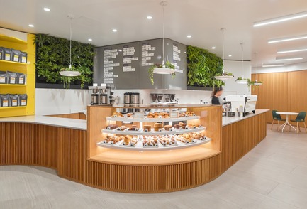 Press kit | 2682-01 - Press release | Innovation Through Design - The Symbiotic Link Between Branding and Architecture - Williamson Williamson Inc. - Commercial Interior Design -    Pilot First Canadian Place Cafe: The retail counter, with a curved seven-foot-long pastry case, is designed with a slatted white oak base that allows it to turn through the space while concealing the equipment below.&nbsp;<br>[Completion Date: September 2017]    - Photo credit: Scott Norsworthy