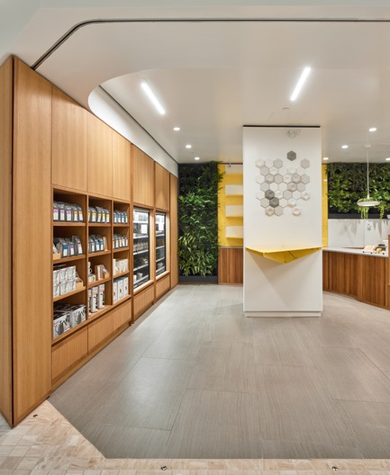 Press kit | 2682-01 - Press release | Innovation Through Design - The Symbiotic Link Between Branding and Architecture - Williamson Williamson Inc. - Commercial Interior Design -    Pilot First Canadian Place Cafe: wood panels anchor the space on either side with shelving units and hidden doors concealing service spaces behind.<br>[Completion Date: September 2017]    - Photo credit:  Scott Norsworthy 