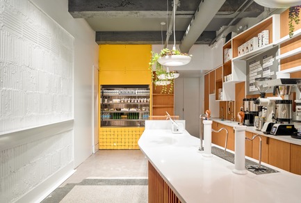 Press kit | 2682-01 - Press release | Innovation Through Design - The Symbiotic Link Between Branding and Architecture - Williamson Williamson Inc. - Commercial Interior Design -   Pilot Union Station Cafe: A compact coffee counter is backed by a custom shelving unit.&nbsp;<br>[Completion Date: December 2017]<br>   - Photo credit: Scott Norsworthy