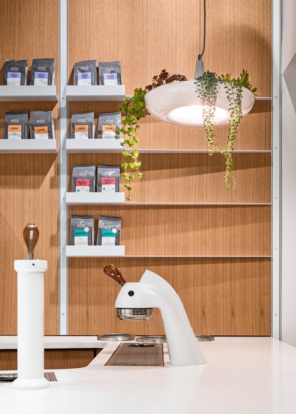 Press kit | 2682-01 - Press release | Innovation Through Design - The Symbiotic Link Between Branding and Architecture - Williamson Williamson Inc. - Commercial Interior Design -    Pilot Union Station Cafe: Thin metal shelves are set into framed white oak panels. Pilot’s palette is modified to create iterative spaces that respond to local conditions.&nbsp;<br>[Completion Date: December 2017]<br>    - Photo credit: Scott Norsworthy