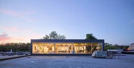 Press kit | 2682-01 - Press release | Innovation Through Design - The Symbiotic Link Between Branding and Architecture - Williamson Williamson Inc. - Commercial Interior Design -    Pilot Wagstaff Office Addition: A sunset view of the work spaces.&nbsp;<br>[Completion Date: 2018]<br>     - Photo credit:  Scott Norsworthy 