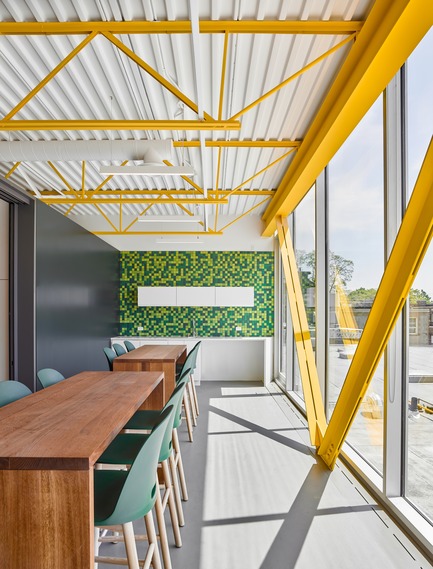 Press kit | 2682-01 - Press release | Innovation Through Design - The Symbiotic Link Between Branding and Architecture - Williamson Williamson Inc. - Commercial Interior Design -    Pilot Wagstaff Office Addition: The pixelated tile wall of the lunch room evokes the living wall in the work space.&nbsp;<br>[Completion Date: 2018]<br>    - Photo credit: Scott Norsworthy