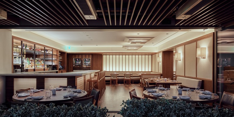 Press kit | 2757-10 - Press release | Montalba Architects Unveils New Hospitality Projects - Montalba Architects - Commercial Architecture - The street-facing restaurant and lounge is layered with warm wood wainscoting, flooring, and furniture made from warm wood, while back-lit from rice-paper glass walls.<span></span> - Photo credit:  Kevin Scott