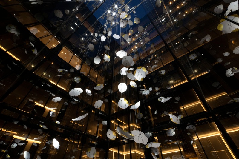 Press kit | 1082-04 - Press release | Pascale Girardin debuts site-specific sculpture for the Four Seasons Hotel Montreal - Pascale Girardin - Art - These garlands cascade through the atrium from the seventeenth to the eighth floor, evoking the cycles of nature.<hr>      <br style=""> - Photo credit: Stephany Hildebrand