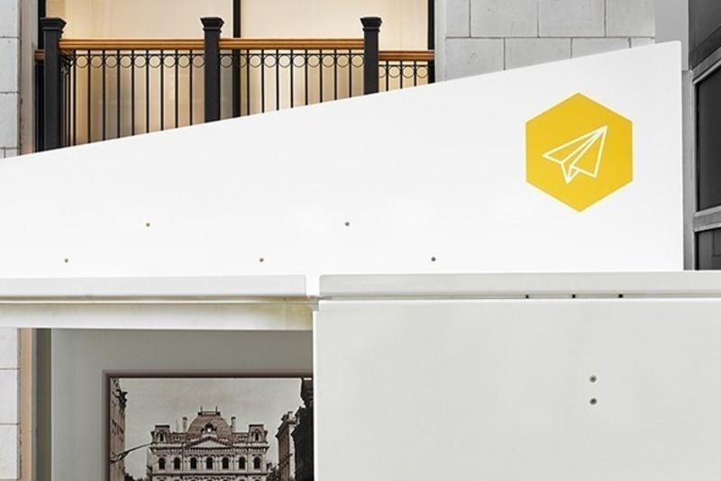 Press kit | 2682-01 - Press release | Innovation Through Design - The Symbiotic Link Between Branding and Architecture - Williamson Williamson Inc. - Commercial Interior Design - Pilot Kiosk: Detail of the 'paper airplane' with logo - Photo credit: Scott Norsworthy