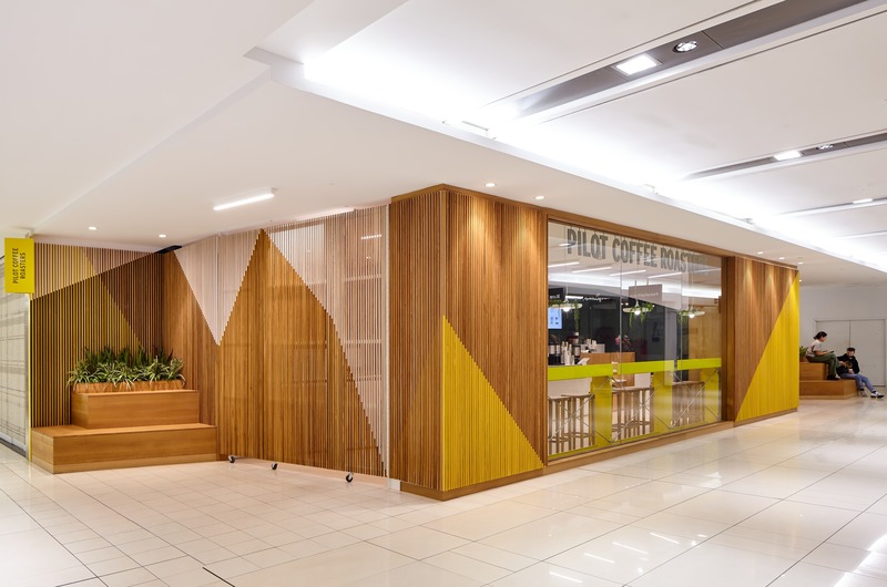 Press kit | 2682-01 - Press release | Innovation Through Design - The Symbiotic Link Between Branding and Architecture - Williamson Williamson Inc. - Commercial Interior Design - Pilot Manulife: A view of the closed entrance with the unfolded slatted gates completing the volume and exposing the unfolded paper airplane pattern. - Photo credit: Scott Norsworthy