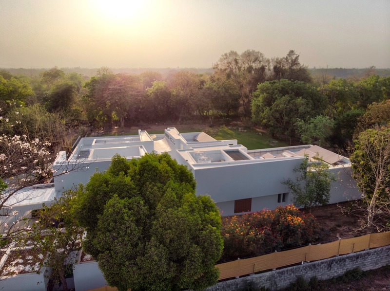 Press kit | 4016-02 - Press release | An Atypical Single User Villa - SquareWorks - Residential Architecture - Ariel view presenting the rural context of the site with distant sub-urban skyline  - Photo credit: Fabien Charuau