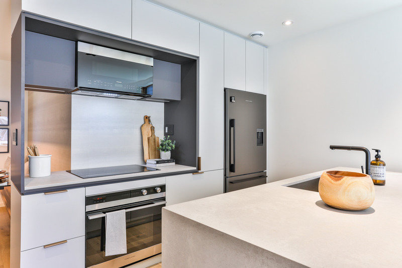 Press kit | 2344-02 - Press release | Two Intertwined Homes - Efficient, Sustainable and Healthy Urban Living - baukultur/ca - Residential Architecture - Kitchen, Unit A <br style=""> - Photo credit: Michael Peart