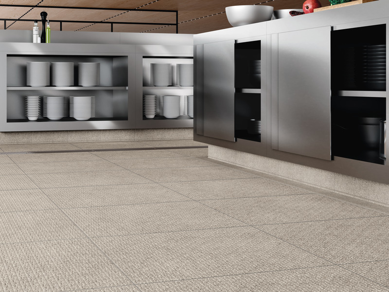 Press kit | 2506-07 - Press release | Agrob Buchtal Cooperates With Designer Sebastian Herkner - AGROB BUCHTAL - Product - "Grid" meets the requirements of the slip-resistance class R12V4, which applies e.g. in commercial canteen kitchens. Used here in the new format 60x60 cm (colour sand-grey). Also a visually and technically perfect solution: ceramic cove skirtings at the bottom of the two "furniture blocks". - Photo credit:  agrob-buchtal.de 