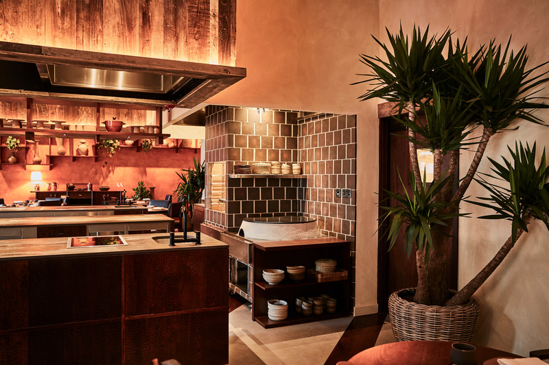 Press kit | 5594-01 - Press release | KOL by A-nrd studio - A-nrd studio - Commercial Interior Design - Kol dining room - Comal and fire pit area  - Photo credit: Charlie Mckay 