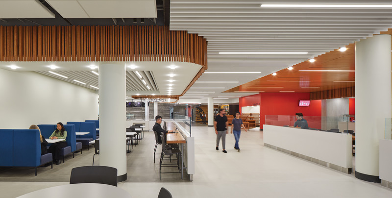 Press kit | 2941-04 - Press release | Newnham Campus Food Hall, Seneca College - Taylor Smyth Architects - Institutional Architecture - The existing campus is defined by a series of buildings connected by a common corridor that originally terminated at a traditional student cafeteria. Taylor Smyth redirected the corridor through the old cafeteria to create a lively pedestrian street lined with food stations, a variety of flexible seating options, banquette seating, and flexible public gathering spaces that can also serve as small event spaces for art shows, buskers, art exhibits etc. - Photo credit: Tom Arban Photography Inc.