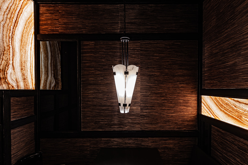Press kit | 5577-02 - Press release | T0 Sumibi Yakiniku | Shibuyanaka Sushi - Nong Studio - Commercial Interior Design - <p class="">Alabaster pendent lamps, which is inspired by umbrellas and canoe from the East, jointed with iron as their structure and decoration at the same time.</p> - Photo credit: Hei Nong