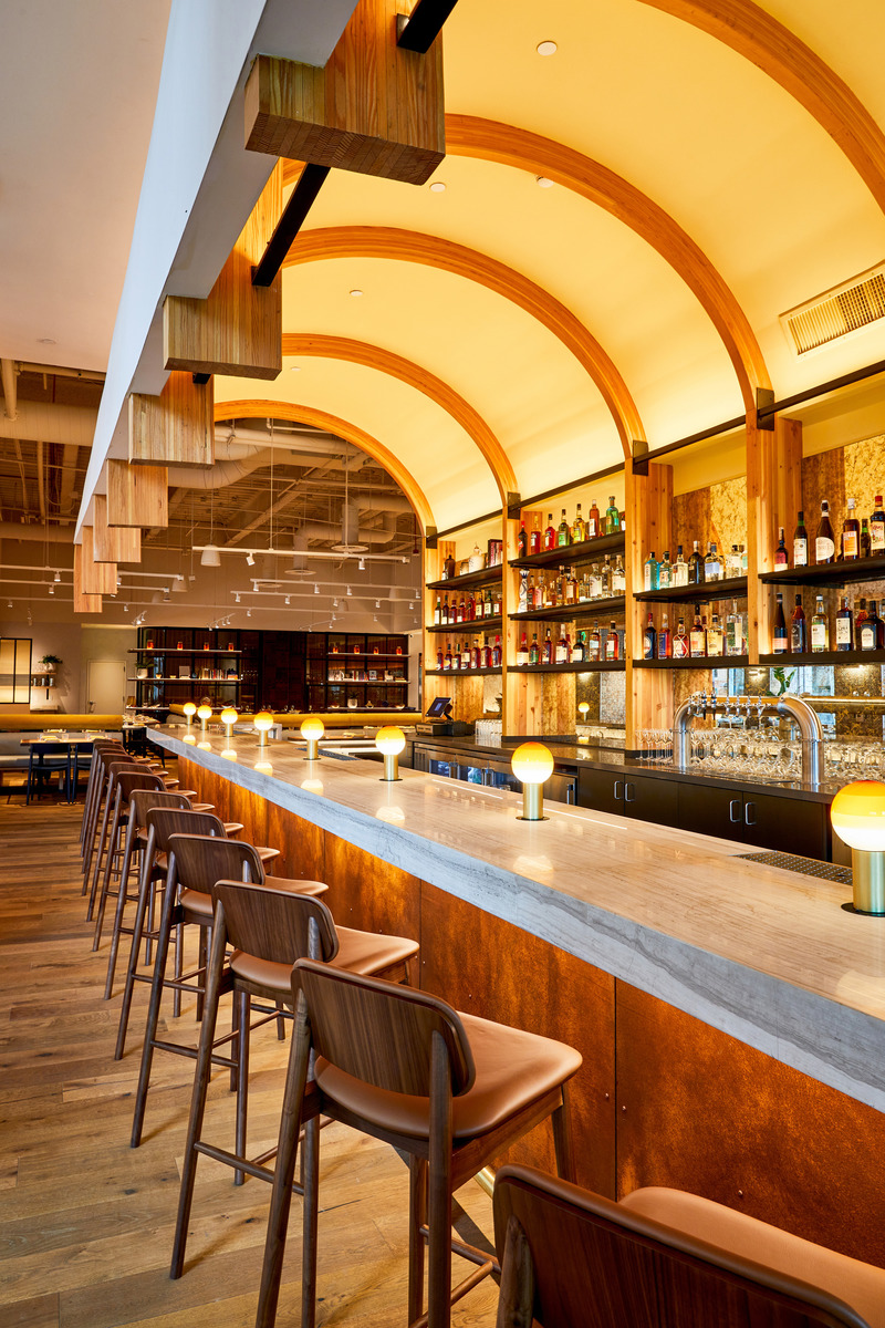 Press kit | 5857-02 - Press release | Studio UNLTD Designs  Callie Restaurant in San Diego to Compliment the Cuisine de Soleil - Studio UNLTD - Commercial Interior Design - The cornerstone of the project is the dramatic arched bar design with its use of structural glulam beams. - Photo credit:  Lucianna McIntosh 