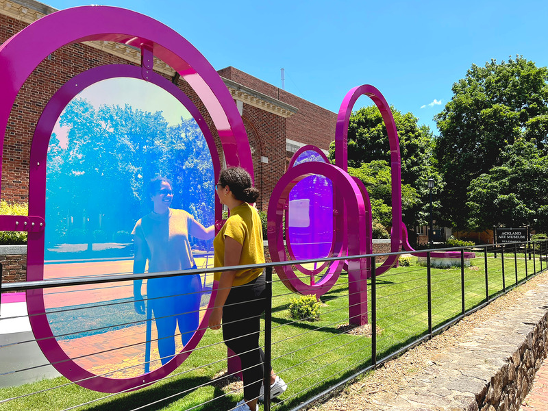 Press kit | 5595-05 - Press release | Art Museum Terrace Transformed into a Programmable Community Space - The Urban Conga - Landscape Architecture - The work utilizes the sun to manipulate the reflection and refraction of colors within the space as well as the shadow play components.   - Photo credit: Ryan Swanson