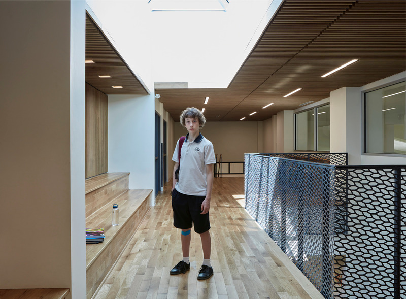 Press kit | 1057-12 - Press release | College St-Hilaire Expansion - KANVA - Institutional Architecture -  Student moving through the horizontal circulation spaces on level 2  - Photo credit: James Brittain