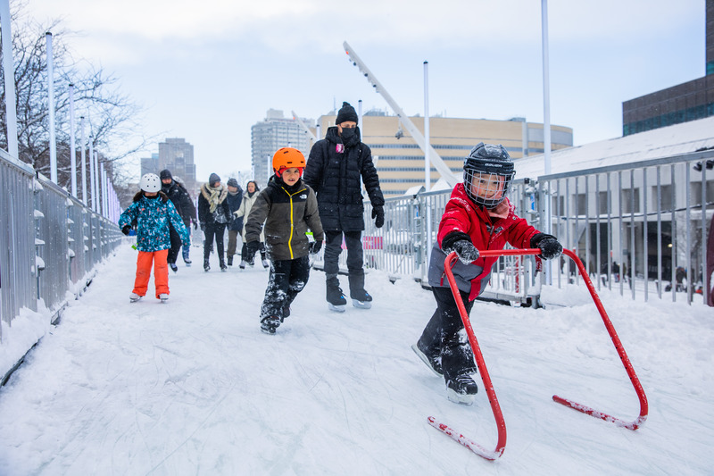 Press kit | 6776-01 - Press release | A Winter Experience Like no Other in the World. The Montréal en Lumière Festival Opens a 1000-Foot-Long Aerial Skating Trail with an Ambience of Immersive Sound and Light - Montréal en Lumière - Urban Design -   Even fresh snow does not stop the skater’s enthusiasm!  - Photo credit:  Frédérique Ménard-Aubin for MONTRÉAL EN LUMIÈRE 