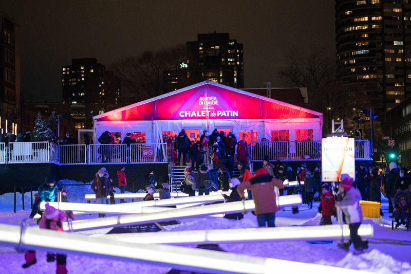 Press kit | 6776-01 - Press release | A Winter Experience Like no Other in the World. The Montréal en Lumière Festival Opens a 1000-Foot-Long Aerial Skating Trail with an Ambience of Immersive Sound and Light - Montréal en Lumière - Urban Design -   <p>Erected in the heart of the Place des Festivals, a bustling social and culinary hub, the Skating Loop is also surrounded by heated oases specially designed to ensure the skaters’ comfort: a chalet in which to put on skates sheltered from the cold and a covered and heated terrace at the Bistro SAQ where everyone is invited to relax after a few laps.</p>    - Photo credit:   Benoit Rousseau for MONTRÉAL EN LUMIÈRE  