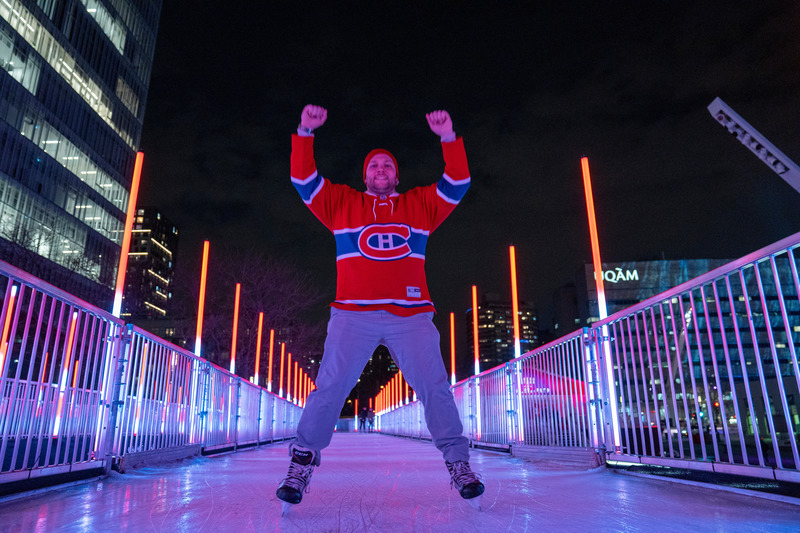 Press kit | 6776-01 - Press release | A Winter Experience Like no Other in the World. The Montréal en Lumière Festival Opens a 1000-Foot-Long Aerial Skating Trail with an Ambience of Immersive Sound and Light - Montréal en Lumière - Urban Design - Public rinks have long been important socio-cultural gathering places that, much like hockey, unite communities. A true hallmark of our “Montréalness,” hockey always has been played in small and large arenas across the city.  - Photo credit:  Victor Diaz Lamich for MONTRÉAL EN LUMIÈRE 