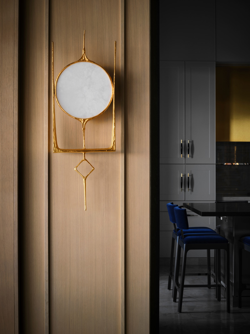 Press kit | 6087-03 - Press release | Family Connections: a Five-Star Retreat in the Desert Southwest - Daniel Joseph Chenin, Ltd. - Residential Interior Design - Hand forged Charles Paris wall sconce set against oak trimmed millwork. - Photo credit:  Douglas Friedman 