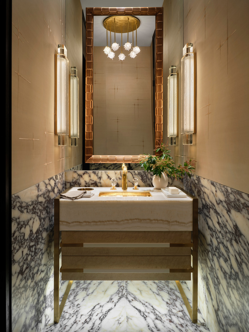 Press kit | 6087-03 - Press release | Family Connections: a Five-Star Retreat in the Desert Southwest - Daniel Joseph Chenin, Ltd. - Residential Interior Design - Powder room clad with a marble wainscoting and hand embordered silk wallcovering complement the custom onyx and burl wood vanities designed by Daniel Joseph Chenin. - Photo credit: Douglas Friedman