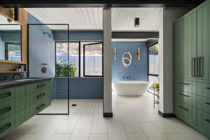 Press kit | 2757-33 - Press release | Gustave Carlson Design Skillfully Stewards an Unlikely Eichler - Gustave Carlson Design - Residential Architecture - The primary bathroom features vanity and cabinets all custom designed by Gustave Carlson. - Photo credit: David Duncan Livingston