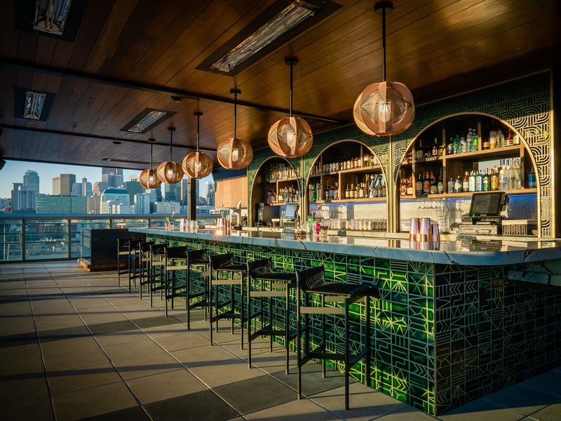 Dossier de presse | 2757-34 - Communiqué de presse | WDA Positions its Practice for the Future - William Duff Architects (WDA) - Architecture commerciale -   <p class="">KAIYŌ Rooftop: The bar—featuring a custom-designed metal screen that frames the back shelving, vibrant green handmade tile, a luminescent quartzite bar top and woven light fixtures—captures the essence of the tropical theme, juxtaposed with an urban backdrop.</p>   - Crédit photo :  Equal Parts Media