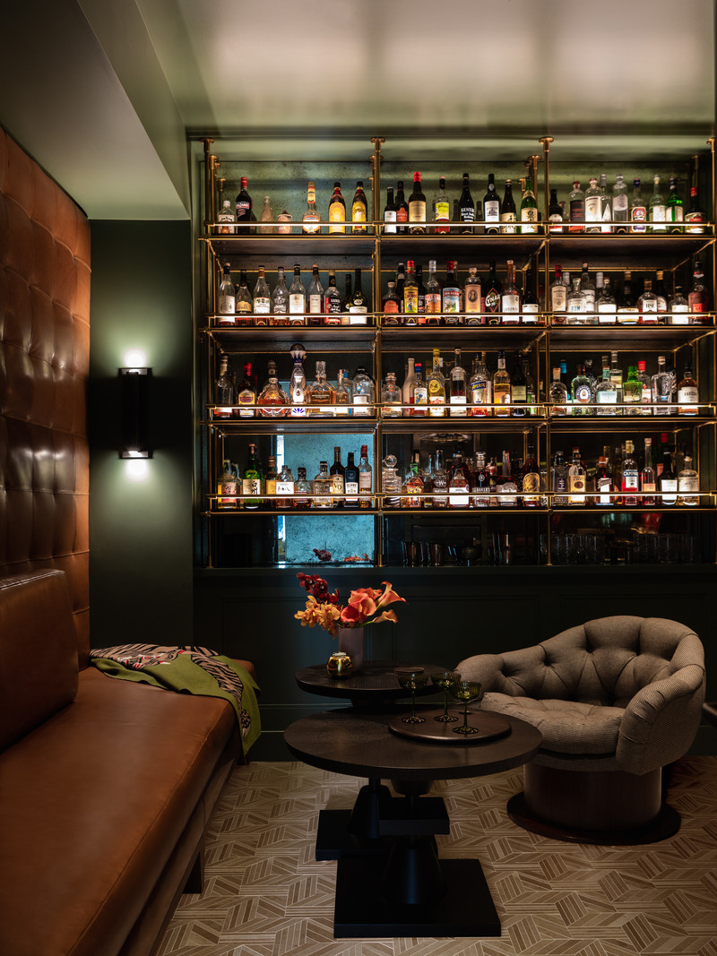 Press kit | 2757-35 - Press release | Medium Plenty Gives a Sprawling Update to a Once Modest 1920s Spanish Revival Home - Medium Plenty - Residential Interior Design -  The family's desire to create an exciting space with depth, character and a sense of fun can be seen in this “English pub” inspired room, showcasing their global spirits collection.  - Photo credit:  Laure Joliet Photography 