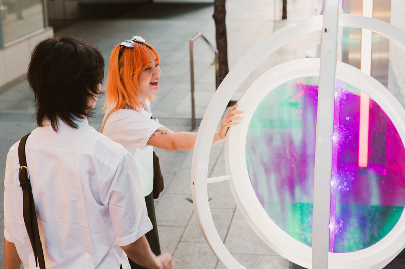 Press kit | 5595-08 - Press release | oPTIK, a New Interactive Sound and Light Installation in New York City - The Urban Conga - Art - As the rings are moved a musical note is played every fifteen degrees of rotation.  - Photo credit: Savannah Lauren