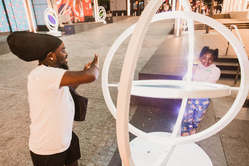 Press kit | 5595-08 - Press release | oPTIK, a New Interactive Sound and Light Installation in New York City - The Urban Conga - Art - Dad and daughter playing with oPTIK together.  - Photo credit: Savannah Lauren