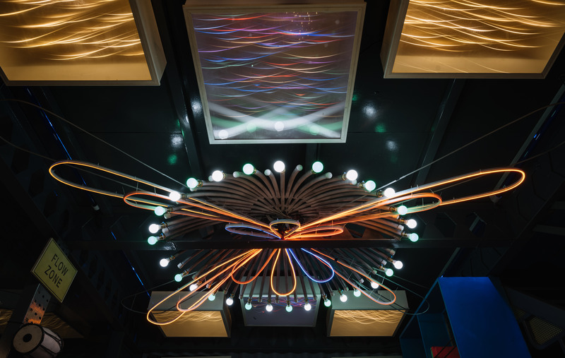 Press kit | 7002-01 - Press release | Big Top - Multitude Of Sins - Commercial Interior Design - <p>The floral neon- tubed chandelier in the lounge area blooms in complete glory as the evening inches on and the surrounding box lights by Nithin Sadhu have been layered with custom filaments that give them a cosmic iridescence!</p> - Photo credit: Ishita Sitwala