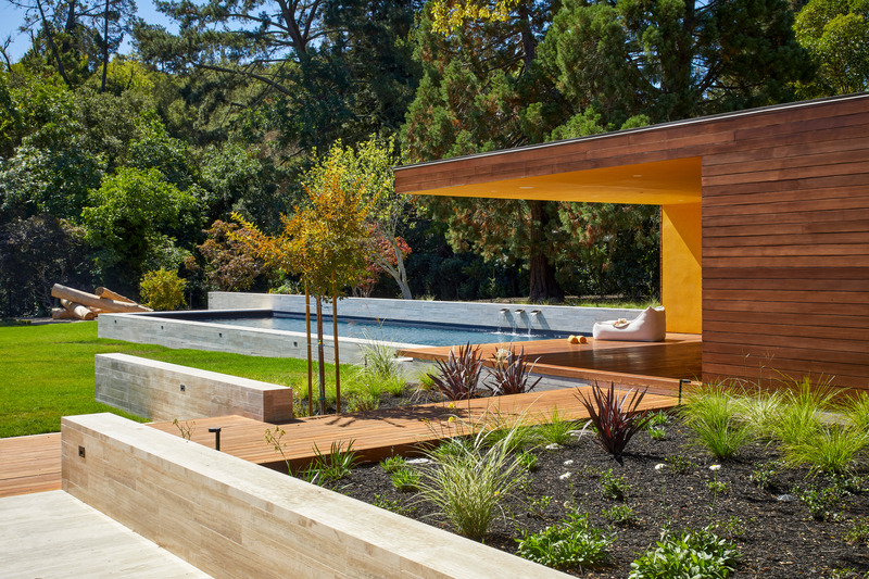 Press kit | 2757-38 - Press release | Swatt Miers Architects Serves Up California Cool with a Warm Modern Twist - Swatt Miers Architects - Residential Architecture -  <p>  Happy Valley Residence:  The viewing area for the pool is made from Cedar siding, Thermory decking and stucco painted with Benjamin Moore Aura Exterior 301 Glen Ridge Gold Low Lustre. In the distance, a children's play structure - made of logs, and designed jointly by the client, Swatt Miers Architects, the landscape architect and the landscape subcontractor - makes an artistic statement. </p>  - Photo credit:   Russell Abraham  