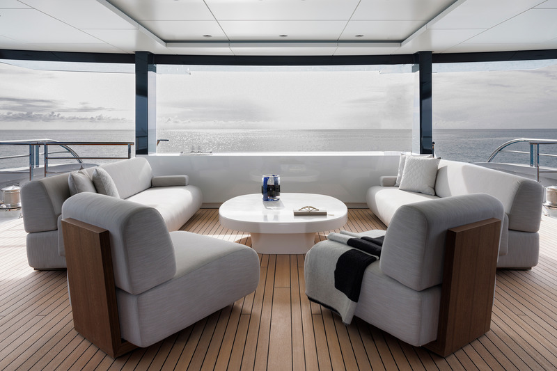 Press kit | 889-06 - Press release | BURDIFILEK Sets Sail Into the World of Luxury Yachting With Entourage - BURDIFILEK - Residential Interior Design - An outdoor social lounge, with a custom-designed coffee table. - Photo credit: Guillaume Plisson