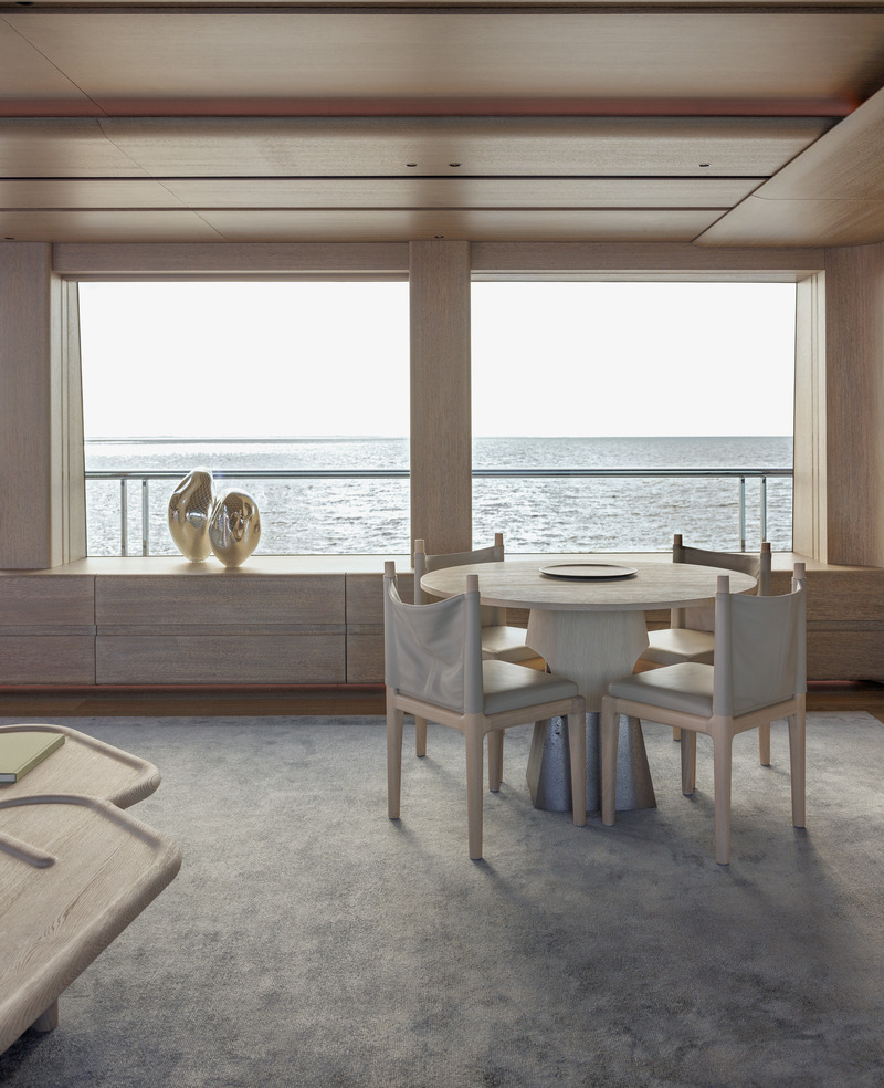 Press kit | 889-06 - Press release | BURDIFILEK Sets Sail Into the World of Luxury Yachting With Entourage - BURDIFILEK - Residential Interior Design - Two sculptures by Simon Waranch and a card table faces a spectacular view of the ocean. - Photo credit: Guillaume Plisson