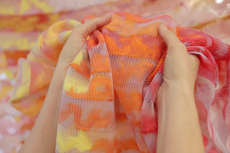 Press kit | 748-48 - Press release | UQAM's Centre de Design "Textile Design Now” Exhibition Showcases the Work of Women Textile Designers and Artists - UQAM Centre de Design - Event + Exhibition - <p>Cécile Feilchenfeldt </p><p class="">Cape de Moa (2022) </p><p class="">Textile (Polyester monofilament, feathers, semi-automatic machine-knit) </p> - Photo credit: Aurélie Cenno