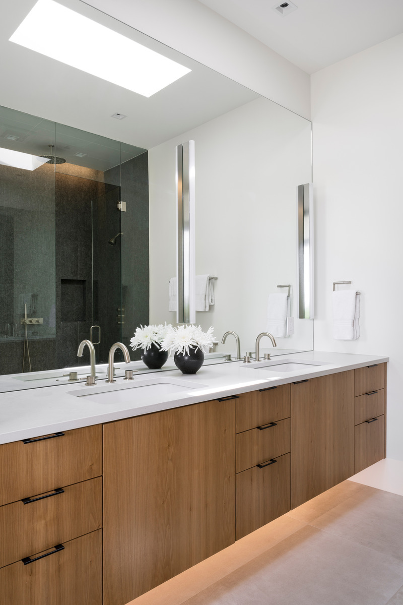 Press kit | 2757-42 - Press release | Sparano + Mooney Architecture's Emigration Creek Residence is Uniquely Shaped by its Site - Sparano + Mooney Architecture - Residential Architecture - <p class="">A prominently-placed skylight and underlit cabinetry bring diffused illumination into the bathroom.</p> - Photo credit: Lucy Call Photography