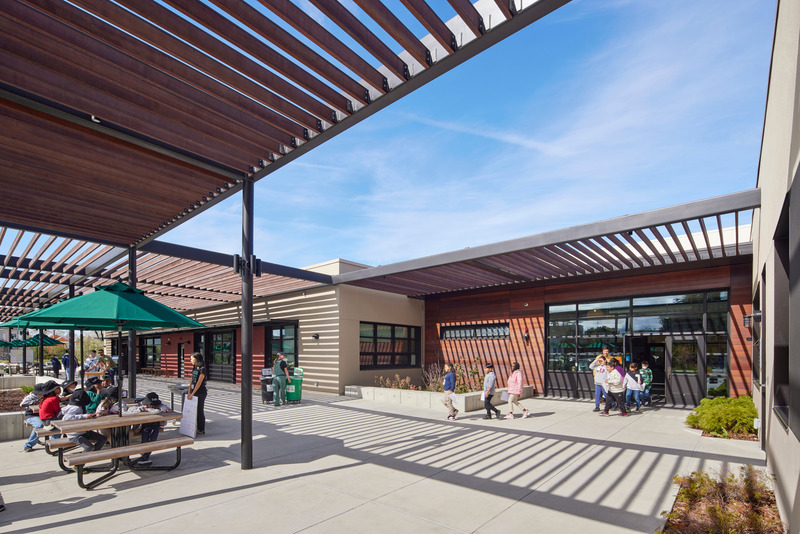 Press kit | 2757-41 - Press release | CAW Architects' Newest Educational Design for Oakland Unified School District Transforms Both Food Education and Distribution - CAW Architects - Commercial Architecture - <p class="">View of the main entrance to the facilities and the signature trellis design, which provides ample shading to the interior classrooms.  </p> - Photo credit: Bruce Damonte Photography 