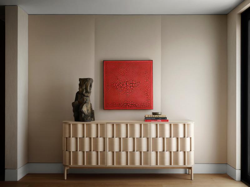 Press kit | 6087-05 - Press release | Palm Residence: A Harmonious Fusion of Hospitality and Home - Daniel Joseph Chenin - Residential Interior Design - A curated vignette in the primary bedroom featuring Ringvide Weave 19 cabinet against  an upholstered wall in Mark Alexander Urbane cotton velvet with an acrylic painting by  Mark Garry and a bronze sculpture by Thomas Junghans. - Photo credit: Douglas Friedman