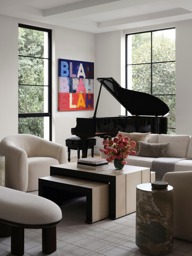 Press kit | 6087-05 - Press release | Palm Residence: A Harmonious Fusion of Hospitality and Home - Daniel Joseph Chenin - Residential Interior Design - Structured, orthogonal lines of the Jean De Merry Axel coffee table with benches  contrasts with the soft curves of the DeMuro Das Corbu bench, Arteriors Herdie accent table,  and custom Axis swivel base lounge chairs. Painting by Mel Bochner. - Photo credit: Douglas Friedman