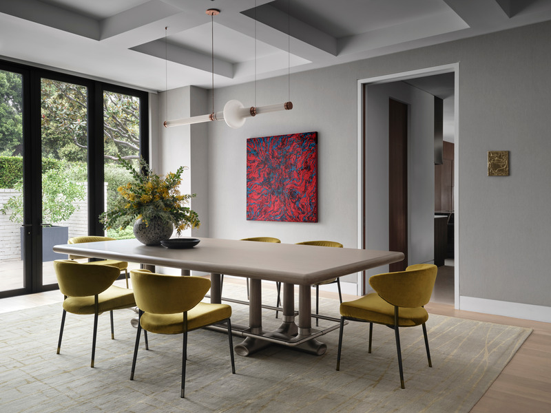 Press kit | 6087-05 - Press release | Palm Residence: A Harmonious Fusion of Hospitality and Home - Daniel Joseph Chenin - Residential Interior Design - A gracefully asymmetrical Luna Kaleido chandelier by Gabriel Scott is suspended above a Randolph &amp; Hein table with custom foot rail, paired with Minotti Mills dining chairs, in the  dining room which features art by Milano Liberi and Jeff Peters. - Photo credit: Douglas Friedman