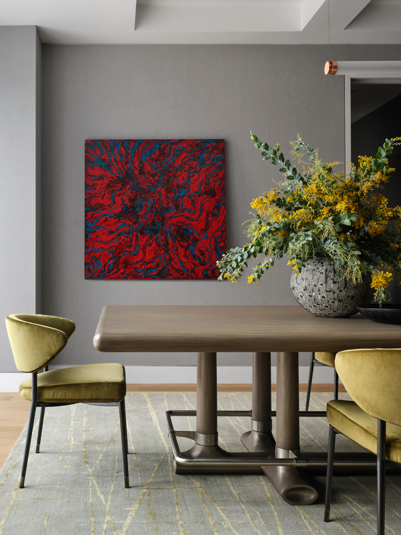 Press kit | 6087-05 - Press release | Palm Residence: A Harmonious Fusion of Hospitality and Home - Daniel Joseph Chenin - Residential Interior Design - Luxe chartreuse velvet by Nobilis wraps the sculptural Minotti dining chairs surrounding a  customized Barker dining table by Randolph &amp; Hein atop the Abel area rug in Pistachio by Stark Carpet with artwork by Milano Liberi. - Photo credit: Douglas Friedman