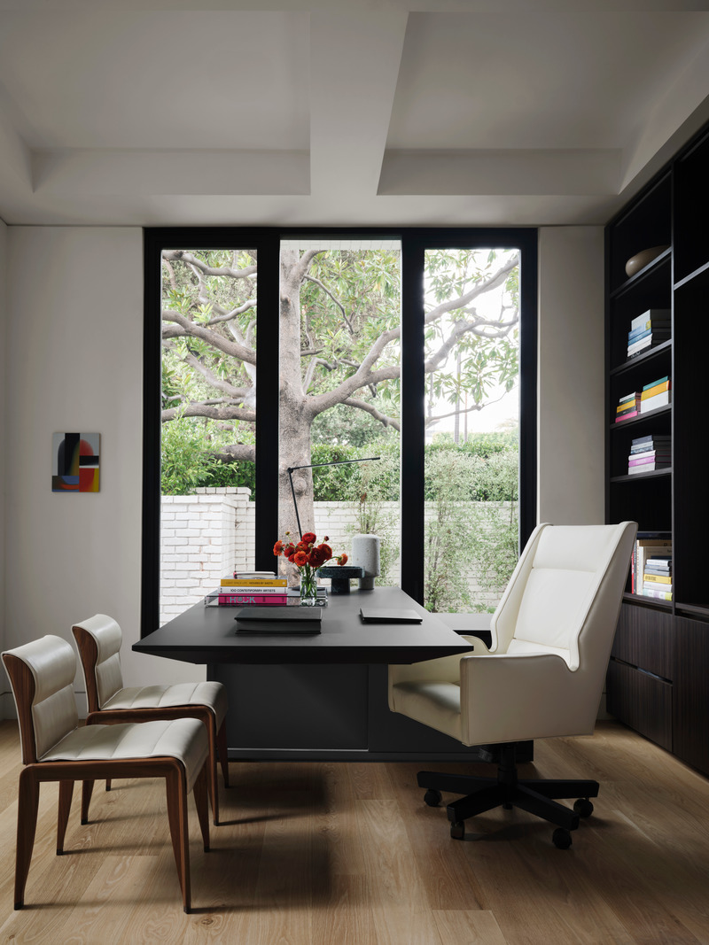 Press kit | 6087-05 - Press release | Palm Residence: A Harmonious Fusion of Hospitality and Home - Daniel Joseph Chenin - Residential Interior Design - Office on the main level features a height adjustable Gravity desk by MDD, Jett high back upholstered swivel chair by Bright Chair Company, Juniper Design task light, guest chairs  by Giorgetti, and art by Jeff Peters.  - Photo credit: Douglas Friedman